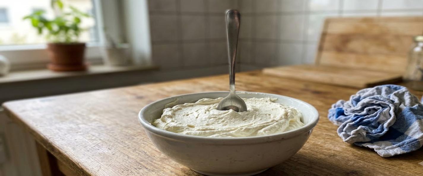Thick Peter Luger style schlag in a white bowl on a wooden kitchen table