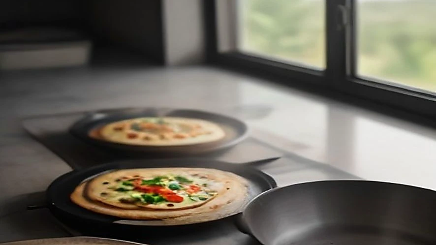 tawa with flatbreads and griddle pan with seared vegetables