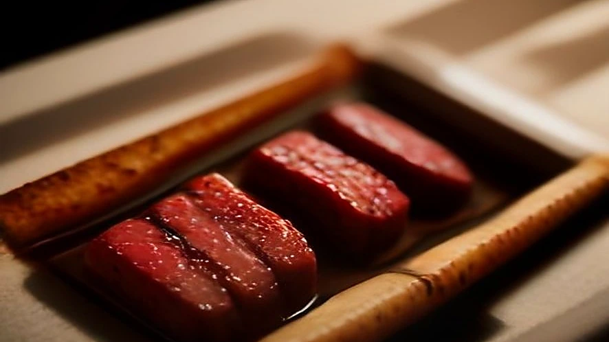 Using a multi-blade tenderizer and a marinade injector on raw meat side by side