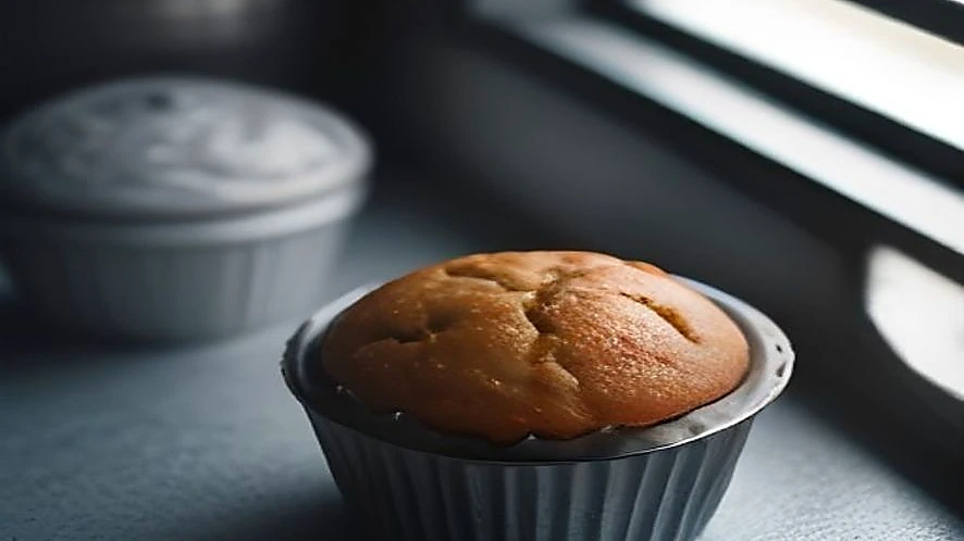 Contrast between rigid metal muffin tin and flexible silicone mould textures