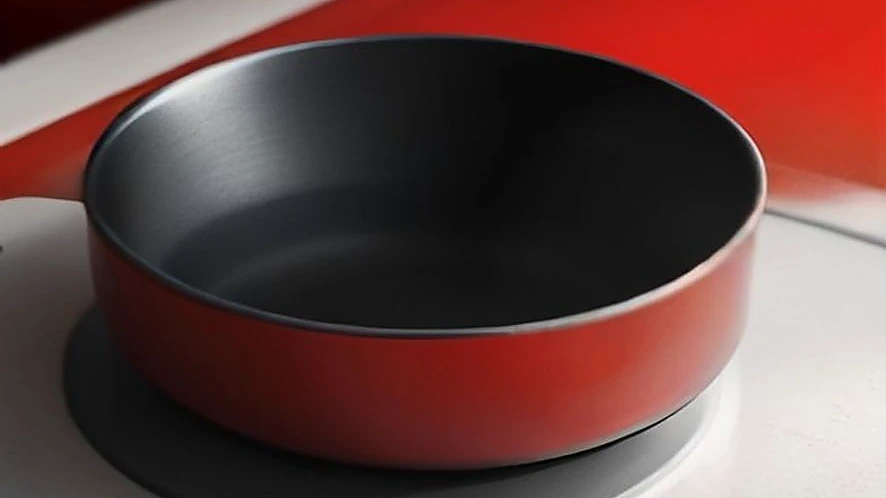 Comparison of induction cooktop magnetic coil heating pan and glowing hot plate surface