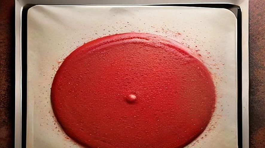 silicone baking mat surface texture next to parchment paper on oven tray