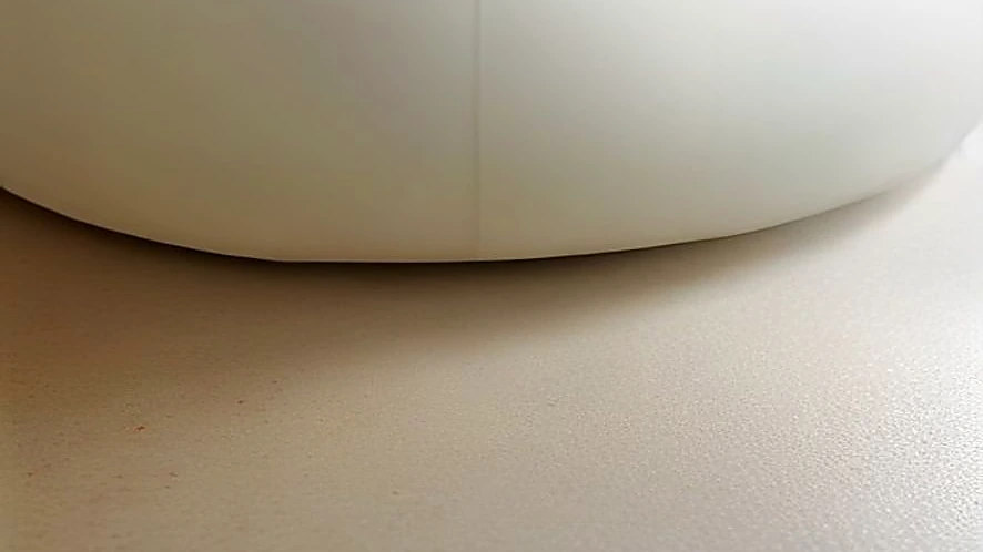 Silicone pastry mat showing printed measurement guides with dough and rolling pin