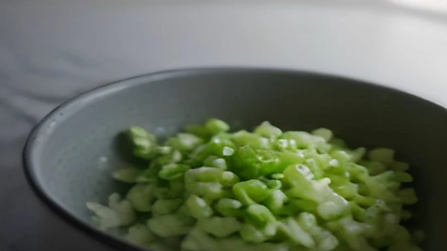 Salad spinner in action with water separating from washed greens