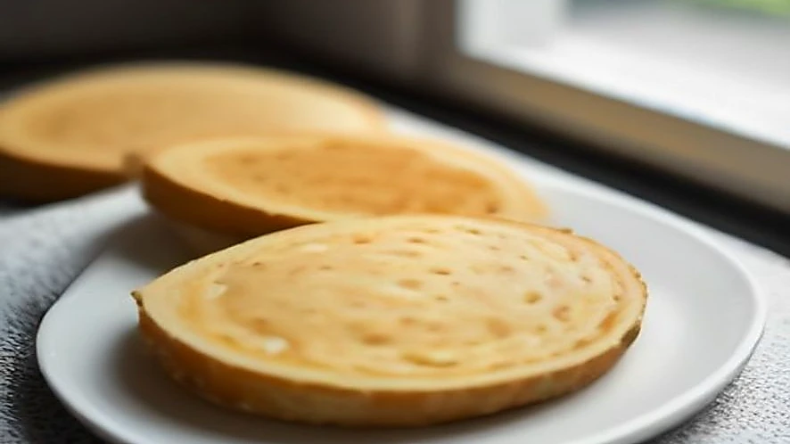 Close-up of sandwich maker's non-stick cooking plates and floating top for even pressing