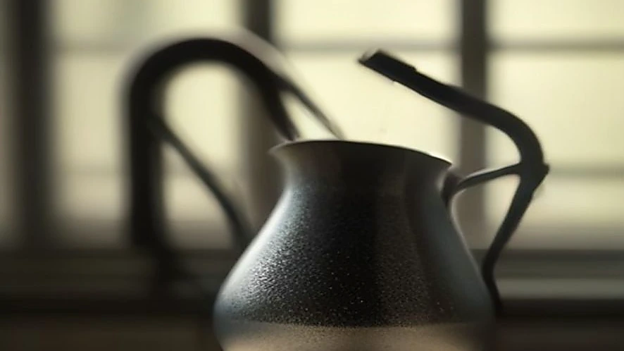 Pour over coffee being brewed with precise water flow from a gooseneck kettle